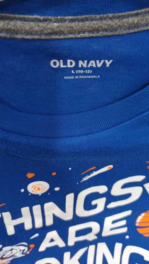 Old Navy Blue Graphic T-shirt (Category: Babies & Kids Fashion) located in Quezon City. Submitted by ddgapstore (Listing ID 1436714856, Image 2). Description: - Old Navy T-shirt - Blue color - Size: L (10-12) - Crew neck, short sleeves.
