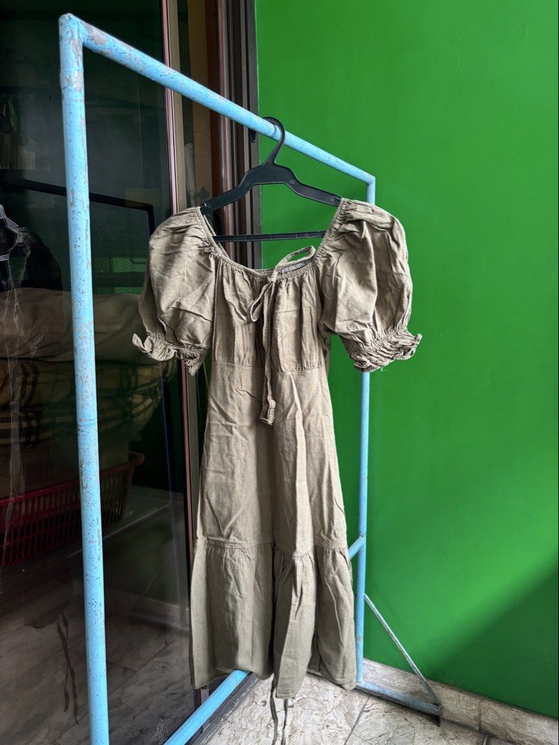 Olive Green Puff Sleeve Dress (Category: Dresses) located in Manila. Submitted by athstore_ph (Listing ID 1436686322, Image 1). Description: Olive green midi dress with puff sleeves, square neckline, tie bust detail, and tiered skirt. Lightweight fabric, perfect for warm weather..