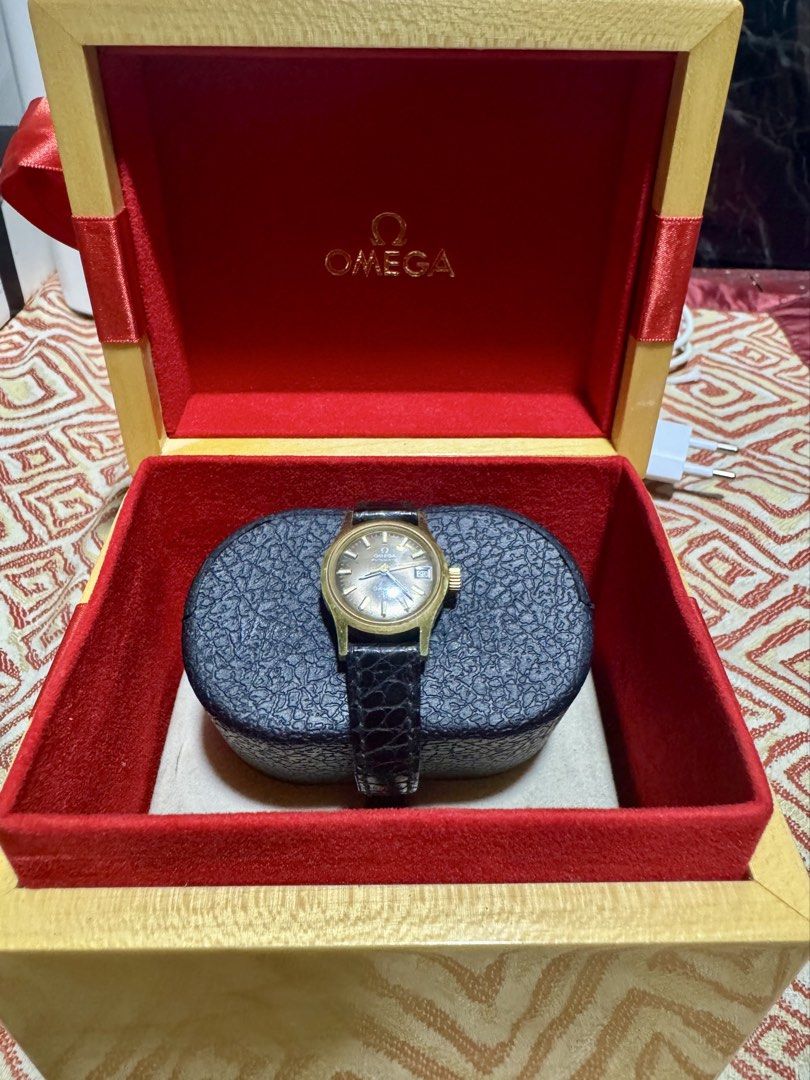 Omega Geneve Automatic Vintage watch (Category: Luxury Watches) located in Quezon City. Submitted by angace13 (Listing ID 1436682696, Image 1). Description: - Vintage Omega geneve watch - Gold-toned face with date display - Black leather strap - Automatic minor scratch only pm nlng sa interested ty.