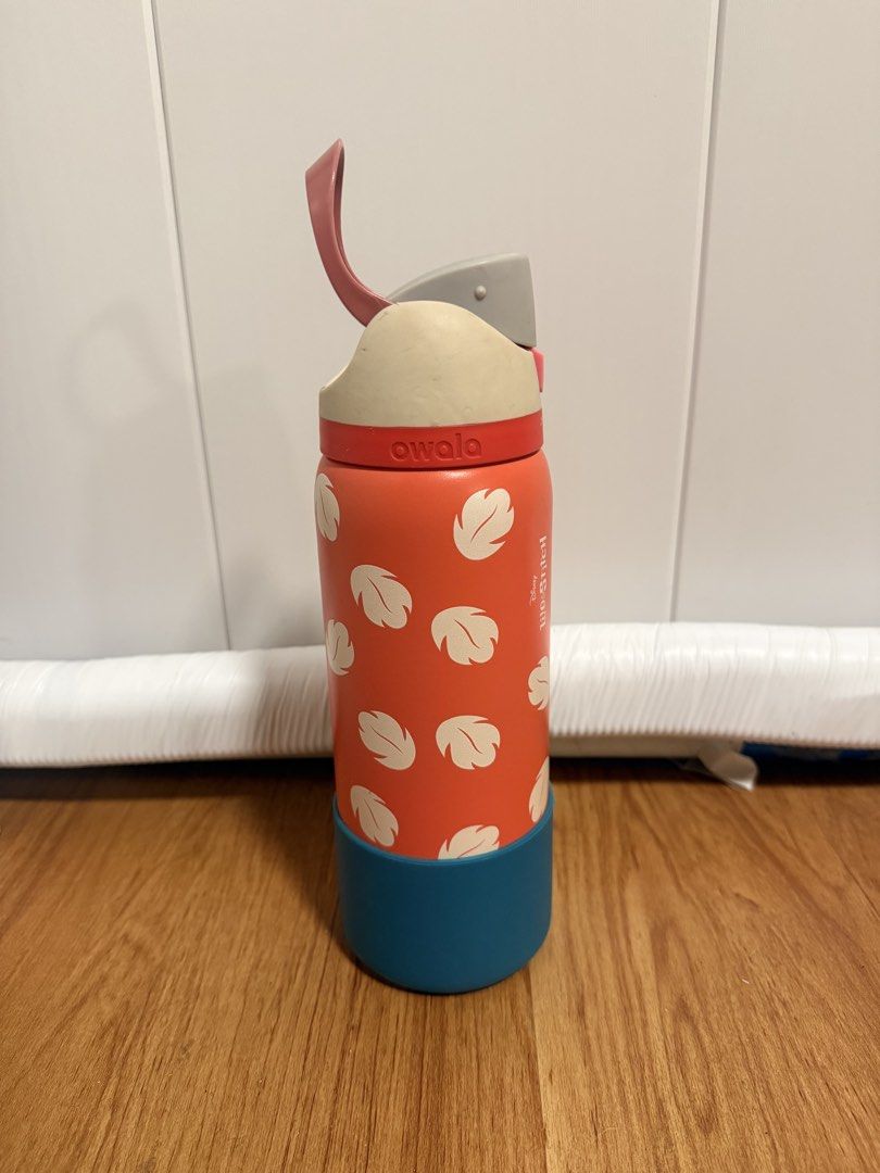 Owala FreeSip Lilo & Stitch Water Bottle 32oz (Category: Water Bottles & Tumblers) located in Las Pinas. Submitted by maddie_closet (Listing ID 1436760219, Image 1). Description: - Owala FreeSip water bottle - Features a Lilo & Stitch design - Red body with white leaf patterns - Teal base - Beige and red lid - Includes a red straw - Designed with a handle for easy carrying Orig Owala Boot Changed the lid (the original one broke) Lid is also authe
