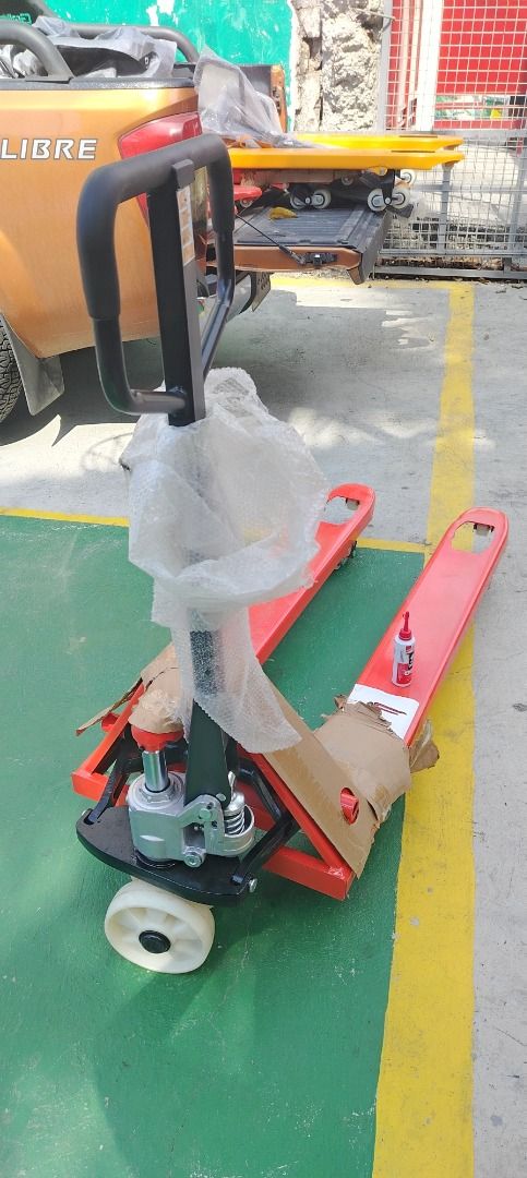 Pallet Jack Narrow Type (Category: Construction Tools & Equipment) located in Quezon City. Submitted by msochea (Listing ID 1436650981, Image 2). Description: - Red pallet jack - Sturdy construction - Easy to maneuver - Features a lifting mechanism - Smooth-rolling wheels - In good working condition - Perfect for heavy loads - Ideal for warehouses and industrial settings.