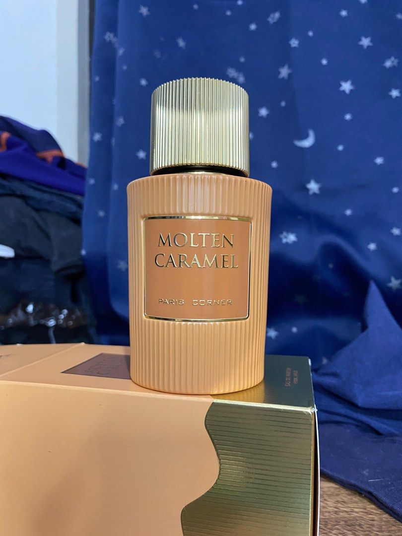 Paris Corner Molten Caramel Eau De Parfum (Category: Fragrance & Deodorants) located in Cagayan de Oro. Submitted by r.twosix (Listing ID 1436798090, Image 2). Description: Molten Caramel Eau De Parfum by Paris Corner (100ml) naka tatlong spray lang po ako nito • Light brown bottle with a gold cap. • Includes original box. • Box features perfume name, brand, ingredients, and other details. Bought this from lazad@ 1,800 nalang 📍Cagayan de Oro Cit