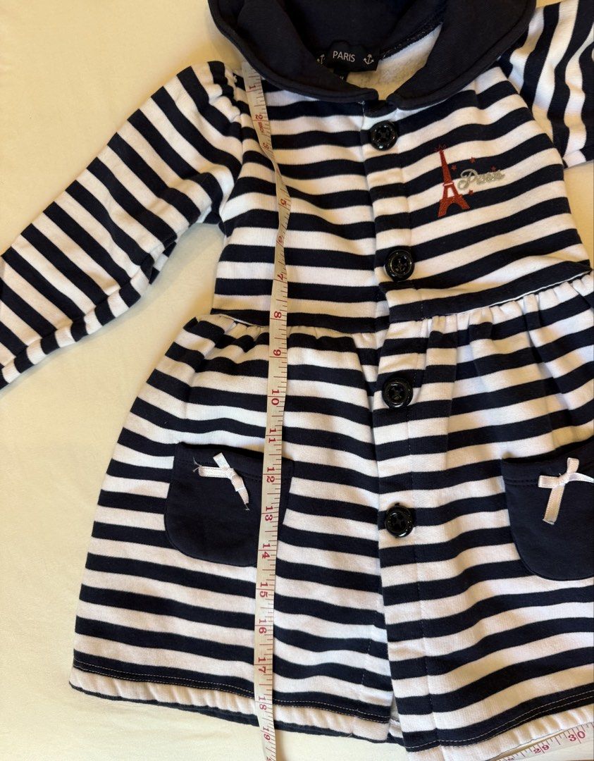 Paris Striped Dress Coat with Hat (Category: Babies & Kids Fashion) located in Manila. Submitted by littleprincesscloset (Listing ID 1436705004, Image 2). Description: - Dress coat and hat set - Navy blue and white striped design - Features a collar and pockets - Eiffel Tower design on the coat - Button closures on the coat - Matching har with red button detail Lalamove within Metro Manila c/o buyer..