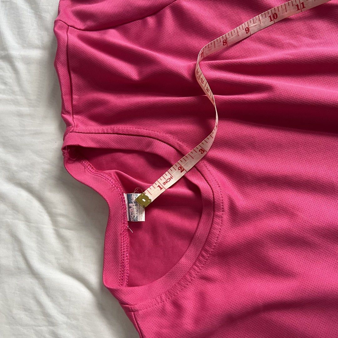Pink Dri-fit T-shirt (Category: Activewear) located in Marikina City. Submitted by helpmedeclutter.ml (Listing ID 1436819494, Image 3). Description: - Pink crew neck t-shirt - Short sleeves - Classic round neckline - Lightweight, breathable fabric - Perfect for everyday wear - Measurements in images - Simple and versatile design Gcash Marikina area.