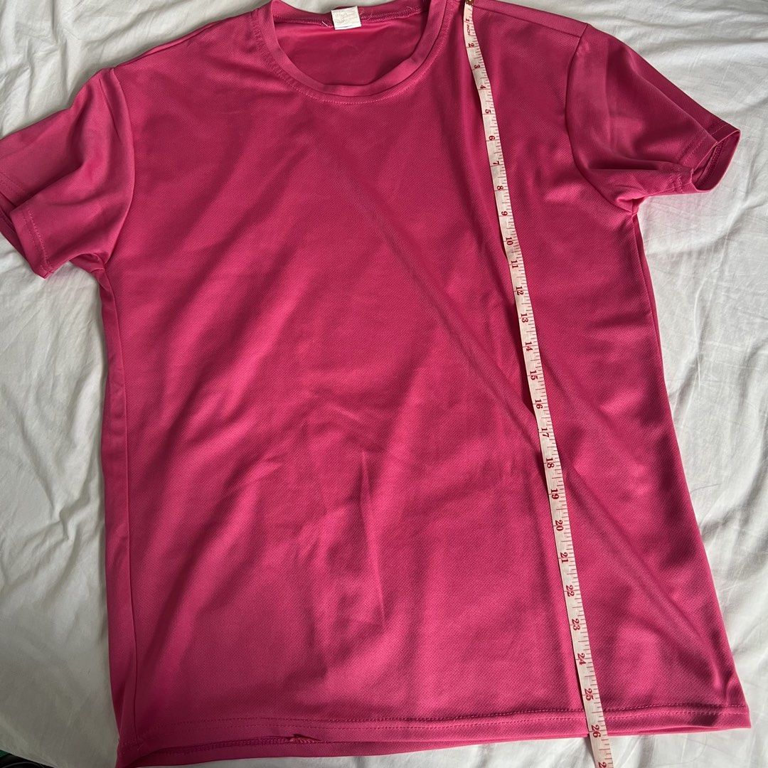 Pink Dri-fit T-shirt (Category: Activewear) located in Marikina City. Submitted by helpmedeclutter.ml (Listing ID 1436819494, Image 2). Description: - Pink crew neck t-shirt - Short sleeves - Classic round neckline - Lightweight, breathable fabric - Perfect for everyday wear - Measurements in images - Simple and versatile design Gcash Marikina area.