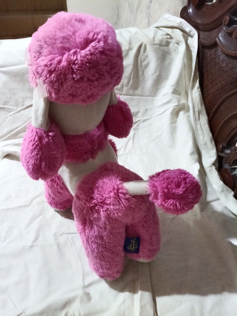 Pink Poodle Stuffed Toy (Blue Magic) (Category: Plushies & Soft Toys) located in Quezon City. Submitted by mhiemime (Listing ID 1436827065, Image 2). Description: - Adorable pink poodle plush toy. - Features fluffy pink head, ears, paws, and tail. - White body. - Black eyes and nose. - Cuddly and perfect for kids or collectors..