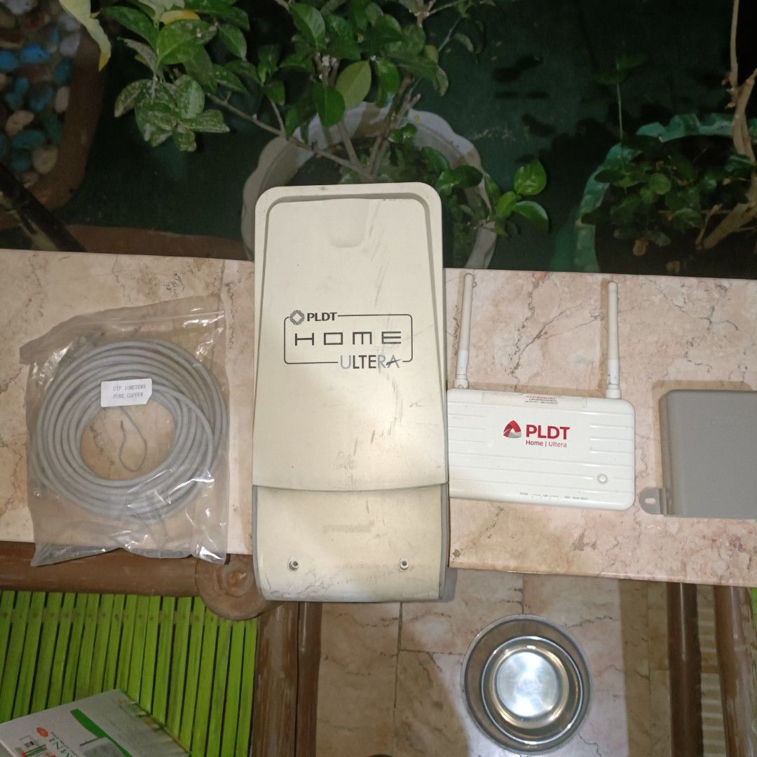 PLDT Home Ultera Router and Antenna (Category: Electrical, Adaptors & Sockets) located in Bulacan. Submitted by jcob_ (Listing ID 1436788373, Image 1). Description: - PLDT Home Ultera Router and Antenna - Includes router unit, antenna, and cables This is from a postpaid plan that we had terminated. They never came to collect this from us. This uses a Smart Bro sim card, you can see the SIM slot in the picture. Not sure if it will work with other 