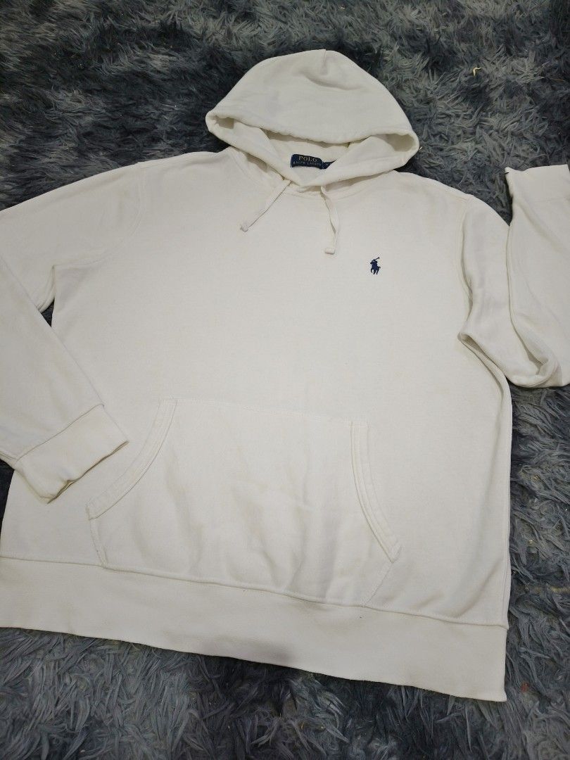 Polo Ralph Lauren Hoodie (Category: Coats, Jackets and Outerwear) located in Manila. Submitted by purefire-477a (Listing ID 1436657048, Image 2). Description: - Cream-colored Polo Ralph Lauren hoodie - Size: M - Features the iconic Polo logo - Drawstring hood - Front pocket - Ribbed cuffs and hem - Made in Guatemala.