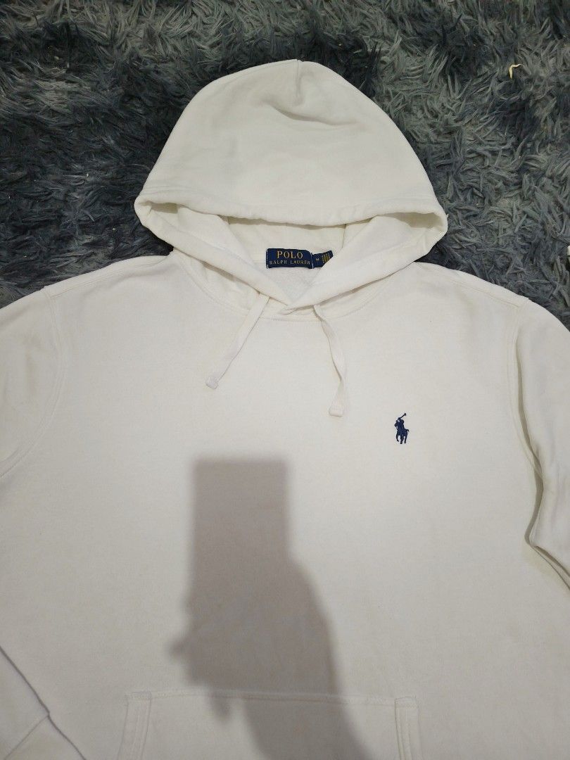 Polo Ralph Lauren Hoodie (Category: Coats, Jackets and Outerwear) located in Manila. Submitted by purefire-477a (Listing ID 1436657048, Image 3). Description: - Cream-colored Polo Ralph Lauren hoodie - Size: M - Features the iconic Polo logo - Drawstring hood - Front pocket - Ribbed cuffs and hem - Made in Guatemala.