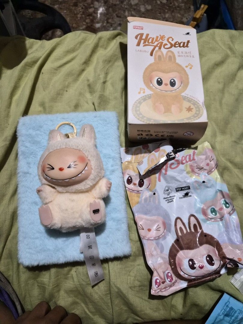 Pop Mart Labubu Have a Seat Keychain (Category: Designer & Blind Box Toys) located in Mandaue City. Submitted by chuchi152615 (Listing ID 1436751754, Image 3). Description: - Adorable Labubu keychain from Pop Mart. - Features a cute sheep design with a smiling face. - Comes with original box and packaging. - Perfect for adding a touch of fun to your bag or keys. - Made of soft, plush material..
