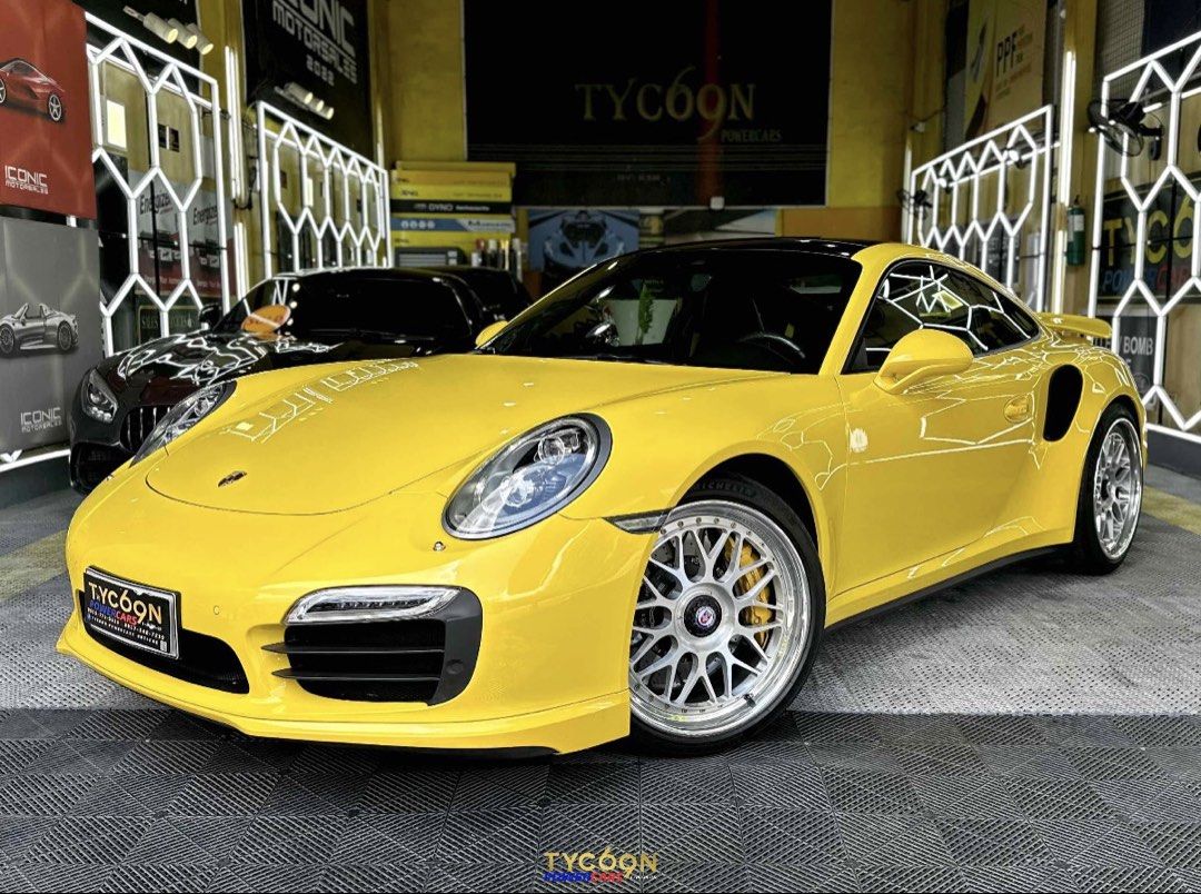 Porsche 911 Turbo S PDK (A) (Category: Used Cars) located in Pasig City. Submitted by tycoon.cars (Listing ID 1436693010, Image 2). Description: PORSCHE CARRERA 911 TURBO S - 2014 Model - 22,XXX Original Mileage - 3.8L Twin-Turbo Flat 6 Engine - Porsche Dual Clutch Transmission (PDK) - Gas - Racing Yellow - HRE Performance Classic Series 300 Rims - Full Akrapovic Exhaust Setup - Monday Coding - SUPER FRESH - LIKE BRAND NEW! We Don’t Sell Cars, We