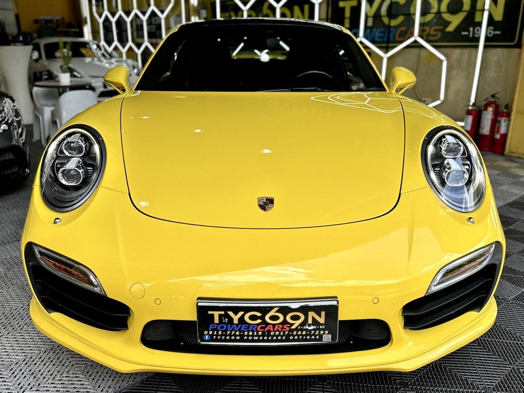 Porsche 911 Turbo S PDK (A) (Category: Used Cars) located in Pasig City. Submitted by tycoon.cars (Listing ID 1436693010, Image 3). Description: PORSCHE CARRERA 911 TURBO S - 2014 Model - 22,XXX Original Mileage - 3.8L Twin-Turbo Flat 6 Engine - Porsche Dual Clutch Transmission (PDK) - Gas - Racing Yellow - HRE Performance Classic Series 300 Rims - Full Akrapovic Exhaust Setup - Monday Coding - SUPER FRESH - LIKE BRAND NEW! We Don’t Sell Cars, We