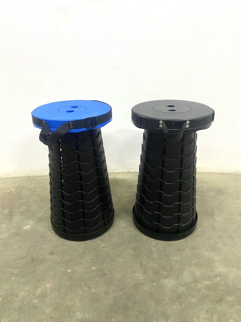 Portable Folding Stool - Blue and Black (Category: Chairs) located in Santa Rosa. Submitted by annie_annie83 (Listing ID 1436741143, Image 2). Description: - Two portable folding stools available - One stool has a blue seat, the other has a black seat - Both stools are black - Features a unique accordion-style design - Includes a handle for easy carrying - Ideal for camping, fishing, and other outdoor activities.
