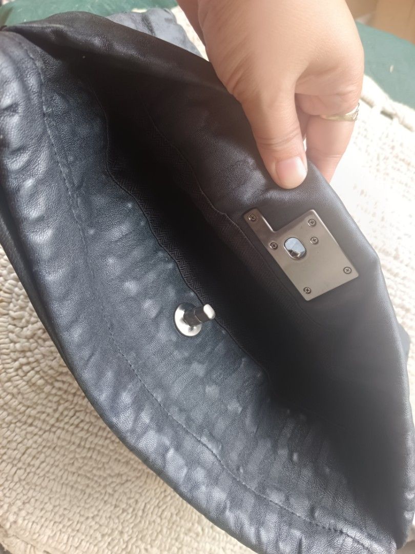 Rouge and lounge RL Clutch Bag (Category: Clutches) located in Dipolog. Submitted by snegrej10 (Listing ID 1436651133, Image 3). Description: - clutch bag. pwede i sling bag. - Quilted design - Leather exterior - Patterned lining - no issue - black in actual - Small interior pocket - Magnetic closure - Stylish accessory.