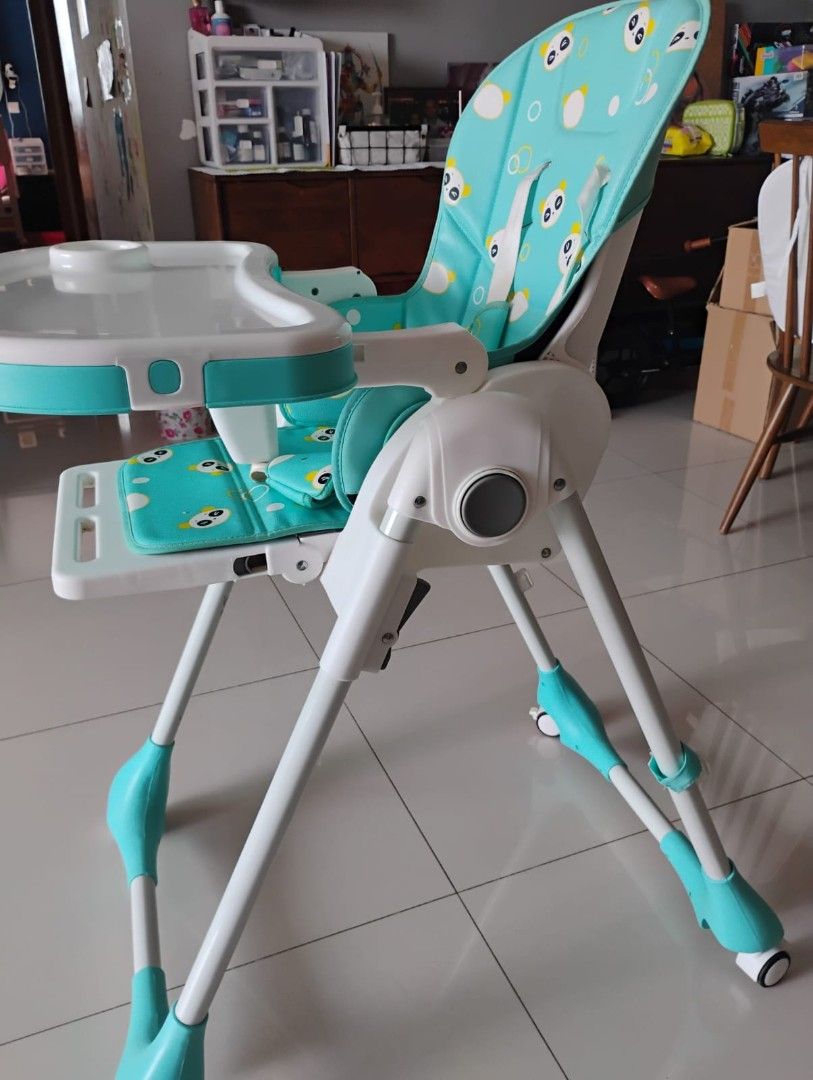 RforRabbit Adjustable Baby High Chair - Teal and White (Category: Baby High Chairs) located in Singapore. Submitted by misha05 (Listing ID 1436755490, Image 1). Description: Very good brand. Features a removable tray, a comfortable padded seat with a cute owl design, and adjustable height settings. The chair is easy to clean and has wheels for easy movement. Perfect for mealtimes!.