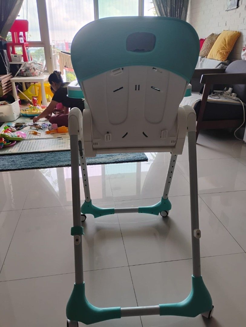 RforRabbit Adjustable Baby High Chair - Teal and White (Category: Baby High Chairs) located in Singapore. Submitted by misha05 (Listing ID 1436755490, Image 2). Description: Very good brand. Features a removable tray, a comfortable padded seat with a cute owl design, and adjustable height settings. The chair is easy to clean and has wheels for easy movement. Perfect for mealtimes!.