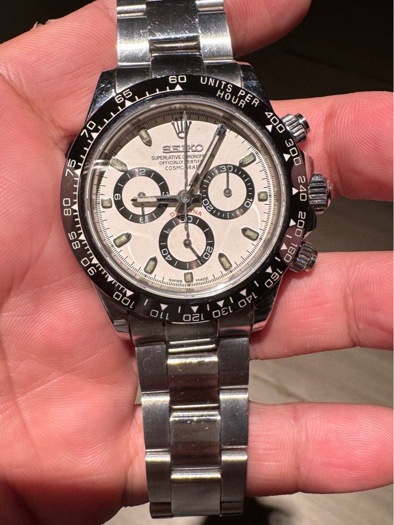 Seiko Daytona Chronograph Watch (Category: Luxury Watches) located in Manila. Submitted by jecsvault (Listing ID 1436806266, Image 1). Description: - Seiko Daytona chronograph MOD watch - White dial - Stainless steel bracelet - Black bezel with units per hour markings - Three sub-dials - Stainless steel clasp - Not your “common” quartz mods out there this is a fully automatic chronograph with tachymeter function. - AUTOMATIC MACHINE (SWISS Valjou