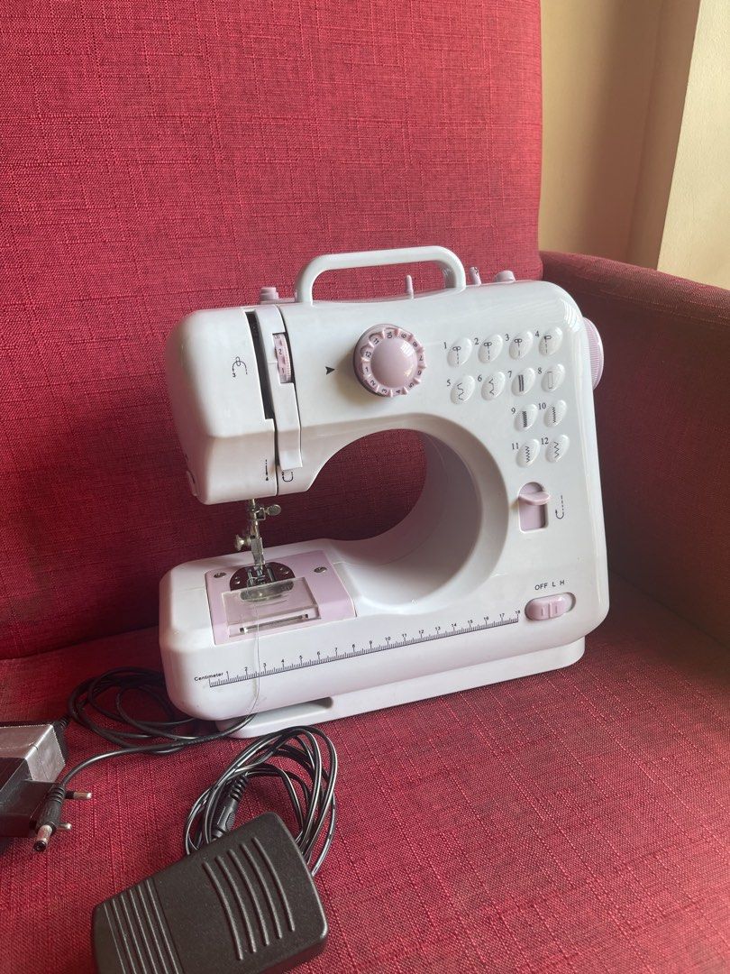 Sewing Machine (Category: Craft Supplies & Tools) located in Mandaluyong City. Submitted by manilasyoungstunna (Listing ID 1436705833, Image 1). Description: RFS: sewing phase ended A little dusty but still works! - Portable sewing machine - Multiple stitch patterns - Includes foot pedal for easy operation - Built-in drawer for accessories - Convenient handle for portability - Comes with power adapter and foot pedal - Stylish white and pink color