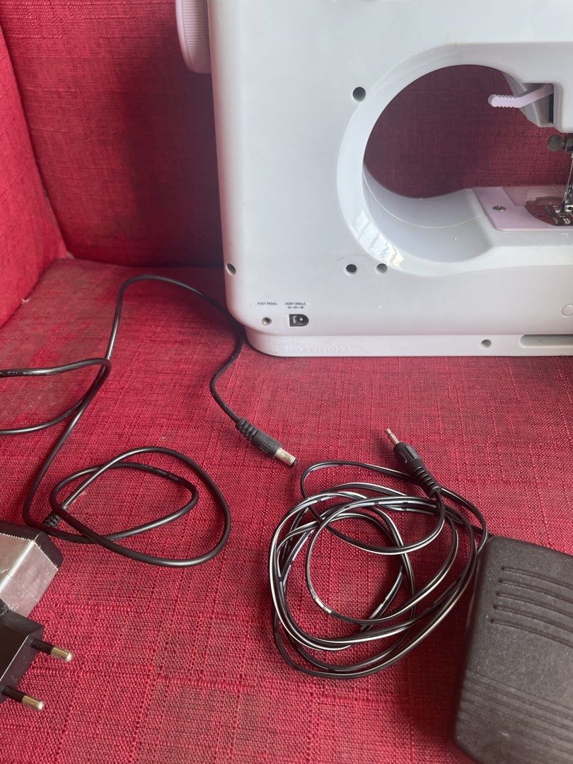 Sewing Machine (Category: Craft Supplies & Tools) located in Mandaluyong City. Submitted by manilasyoungstunna (Listing ID 1436705833, Image 3). Description: RFS: sewing phase ended A little dusty but still works! - Portable sewing machine - Multiple stitch patterns - Includes foot pedal for easy operation - Built-in drawer for accessories - Convenient handle for portability - Comes with power adapter and foot pedal - Stylish white and pink color