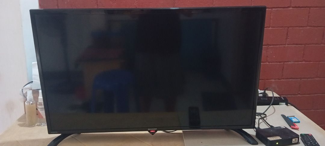Sharp Aquos 32" | 2T-C32CB1M | Basic TV (pre-owned) (Category: TV) located in Marikina City. Submitted by leoricktechservices (Listing ID 1436692466, Image 2). Description: Sharp Aquos 32" | 2T-C32CB1M | Basic TV (pre-owned) Condition: Used but in good condition. RFS: It belonged to my late mother and hasn't been used in a year. Disposing everything not in use. Honest Issue: I don't know why my mother used masking tape all around the edge which l