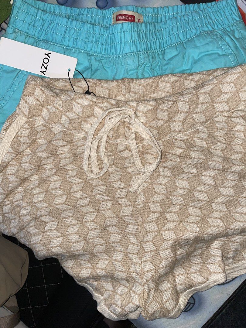 Shorts set (Category: Shorts) located in Plaridel. Submitted by julien_stuff (Listing ID 1436788813, Image 1). Description: Stylish shorts featuring a unique geometric pattern. They have a drawstring closure and a comfortable fit. The shorts are new with tags. Perfect for casual wear. The shorts are a neutral color with a white drawstring and side stripe..