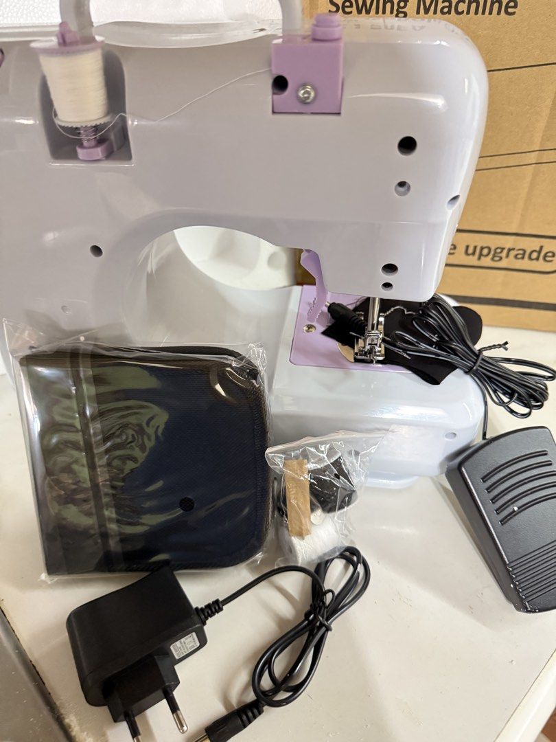 SM-505A Household Electric Sewing Machine (Category: Other Home Appliances) located in Manila. Submitted by jj11662 (Listing ID 1436713703, Image 3). Description: - SM-505A Electric Sewing Machine - 12 Stitch Patterns - Two-Lane Sewing - Two Speed Settings - Includes Foot Pedal - Built-in Small Light - Small Drawer for Accessories - Power Options: DC 6V or 4AA Batteries - Package Includes: Sewing Machine, Foot Pedal, Power Adapter, and Accessorie