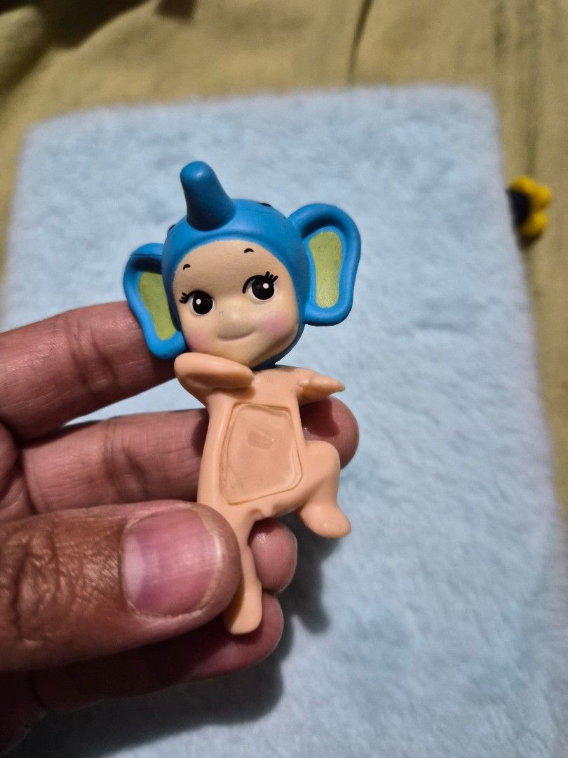 Sonny Angel Elephant Hipper from Looking Back Series (Category: Designer & Blind Box Toys) located in Mandaue City. Submitted by chuchi152615 (Listing ID 1436672696, Image 1). Description: This collectible mini figure is designed with adhesive tape to be attached to flat surfaces like phones or laptops. Material: PVC.