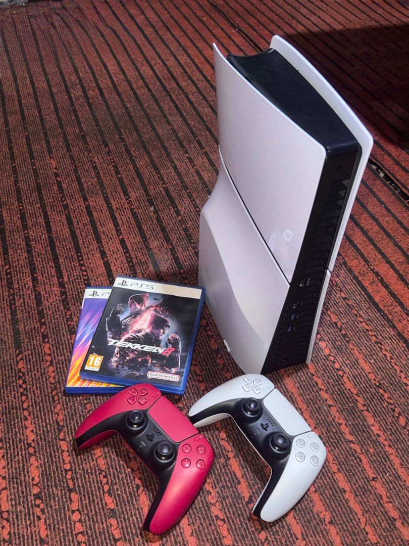 Sony PlayStation 5 Console Bundle (Category: PlayStation) located in Manila. Submitted by exrosa (Listing ID 1436681886, Image 2). Description: - PlayStation 5 console included - Two controllers: one white, one red - Games: Tekken 8 and NBA 2K24 - Ready to play immediately - Complete gaming setup.