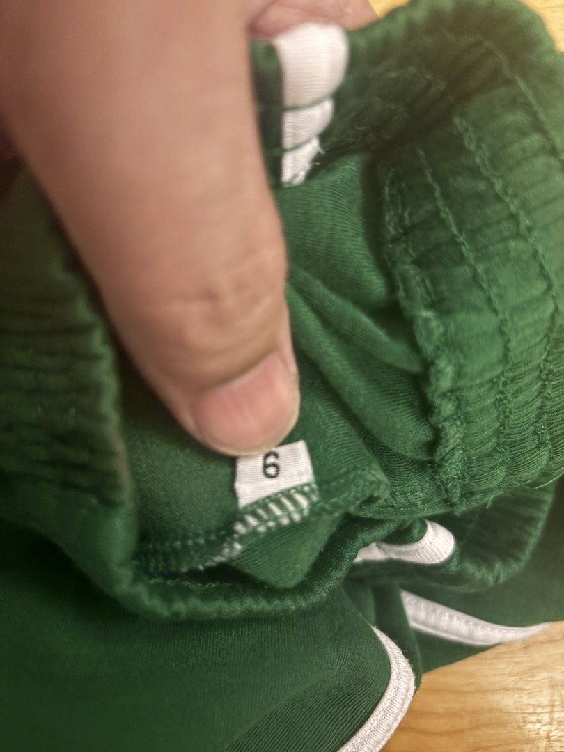 SPUQC PE jogging pants (Category: Babies & Kids Fashion) located in Quezon City. Submitted by dtzee (Listing ID 1436801186, Image 3). Description: - Green track pants - White stripes on sides - Size 6 - Elastic waistband - Back pocket - Comfortable material - Ideal for casual or sports use lp - SPUQC jogging pants.