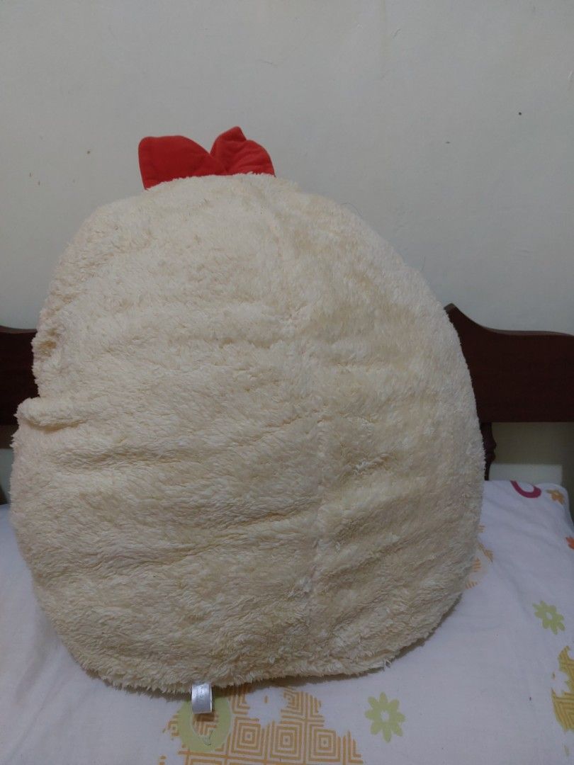 Sumikko Gurashi Chicken Plush Pillow (Category: Plushies & Soft Toys) located in Mandaluyong City. Submitted by 13thsilverrabbit (Listing ID 1436809946, Image 3). Description: Adorable Sumikko Gurashi plush pillow features a chicken design. It has a soft, fluffy texture and a red bow. The plush is in a round shape. The tag indicates it is a 2020 San-X product. Perfect for cuddling or as a decorative piece..