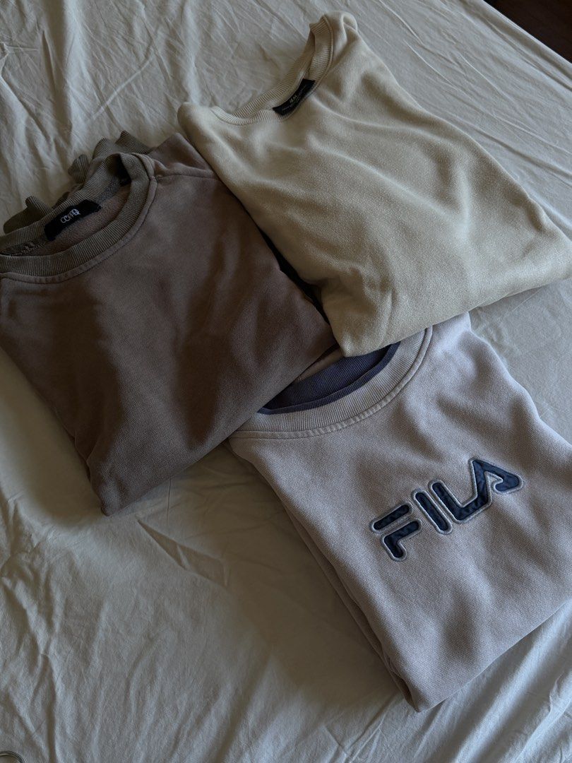 Sweatshirts Bundle - COPPER, H&M, FILA (Category: Coats, Jackets and Outerwear) located in Manila. Submitted by chamyto_ (Listing ID 1436815283, Image 2). Description: - Bundle includes three crew neck sweatshirts: - COVE (brown) - H&M (cream) - FILA (navy blue logo) - All with ribbed collars. - Perfect for casual everyday wear. - All original. get all 3 for 1,300 one only: 500 each.