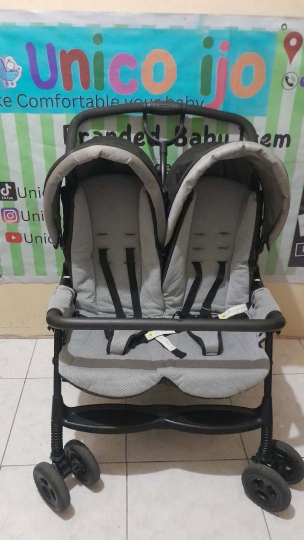 Tandem Twins Stroller (Category: Strollers) located in Caloocan City. Submitted by Unicoijo02 (Listing ID 1436824625, Image 1). Description: - Tandem stroller ideal for twins or siblings - Two seats with individual canopies - Equipped with safety harnesses - Stylish black frame with gray seating - Foldable design for easy storage and transport - Durable wheels suitable for various terrains.