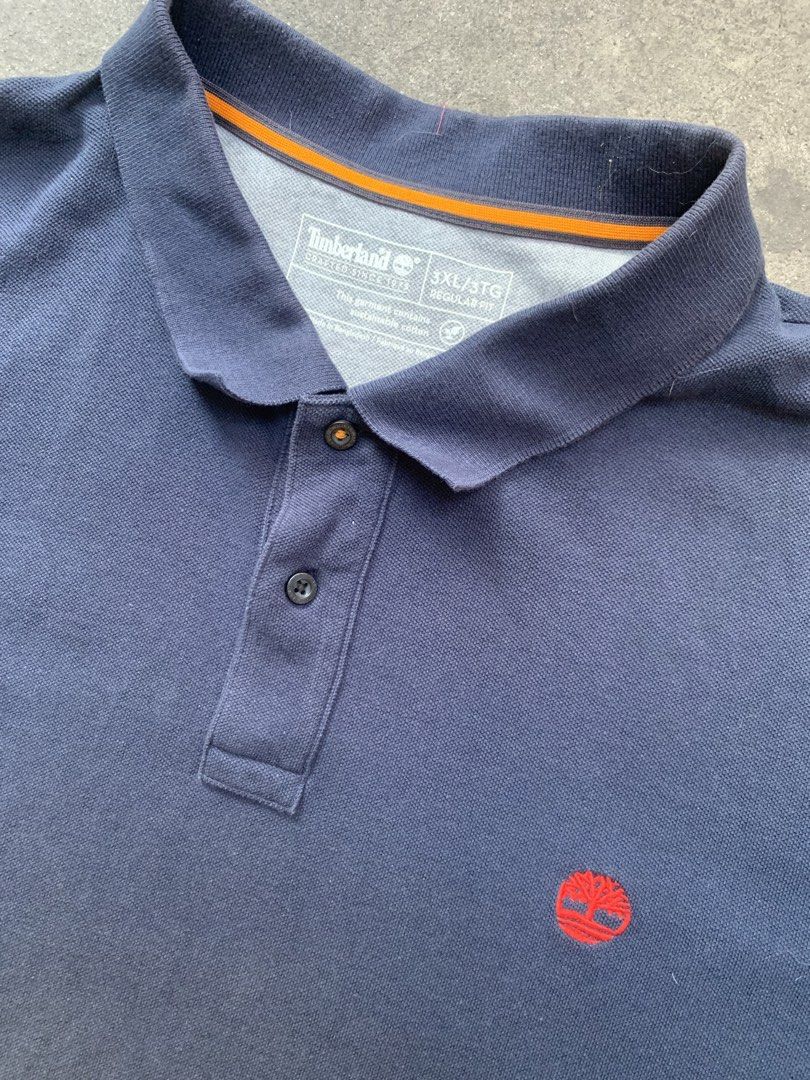 Timberland Polo Shirt XL (Category: Tshirts & Polo Shirts ) located in Manila. Submitted by dendenocil51476 (Listing ID 1436734609, Image 2). Description: - Navy blue Timberland polo shirt - Size: 3XL - Material: Cotton - Features Timberland logo - Collared neckline with three-button placket.