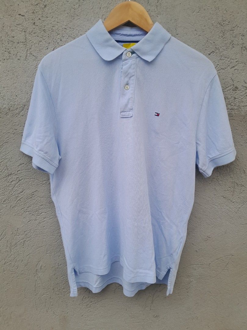Tommy Hilfiger Light Blue Polo Shirt (Category: Tshirts & Polo Shirts ) located in Manila. Submitted by phil_thrift (Listing ID 1436655414, Image 1). Description: - Tommy Hilfiger Light blue polo shirt - Classic collar and short sleeves - Features a small logo on the chest - Three-button placket - Lightweight fabric, ideal for warm weather.