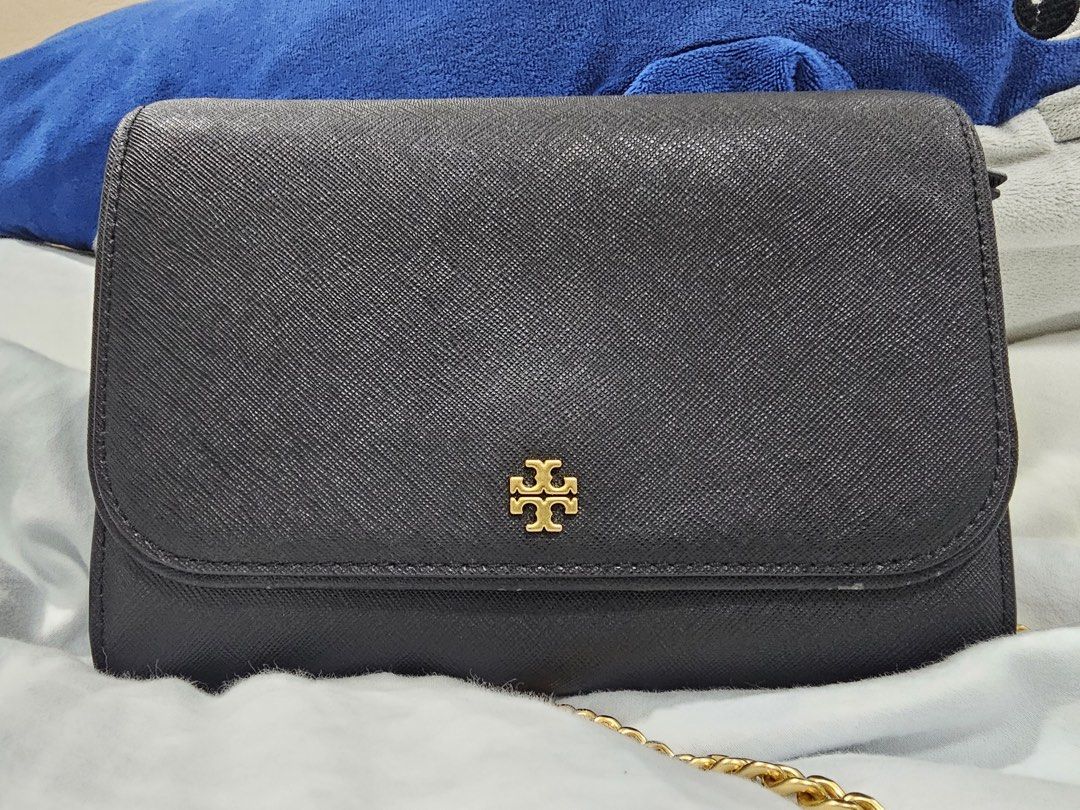 Tory Burch Emerson Chain Wallet (Category: Luxury Bags & Wallets) located in Paranaque City. Submitted by joyzann (Listing ID 1436795486, Image 3). Description: - Tory Burch Emerson Wallet on Chain - Gold chain strap - Flap closure with gold Tory Burch logo - Interior with multiple compartments - Zippered pocket - Textured material - Includes long strap for shoulder/crossbody wear - with few signs of usage. See last pictures - 17k+++ in zalora - 
