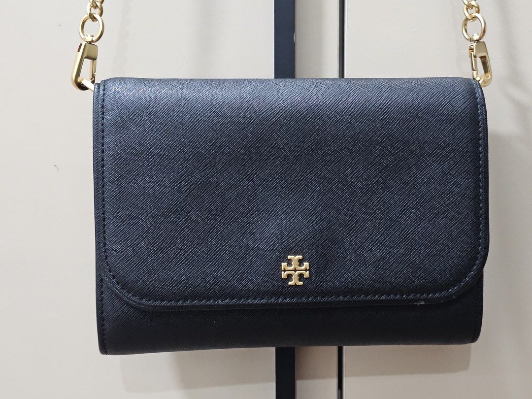 Tory Burch Emerson Chain Wallet (Category: Luxury Bags & Wallets) located in Paranaque City. Submitted by joyzann (Listing ID 1436795486, Image 1). Description: - Tory Burch Emerson Wallet on Chain - Gold chain strap - Flap closure with gold Tory Burch logo - Interior with multiple compartments - Zippered pocket - Textured material - Includes long strap for shoulder/crossbody wear - with few signs of usage. See last pictures - 17k+++ in zalora - 