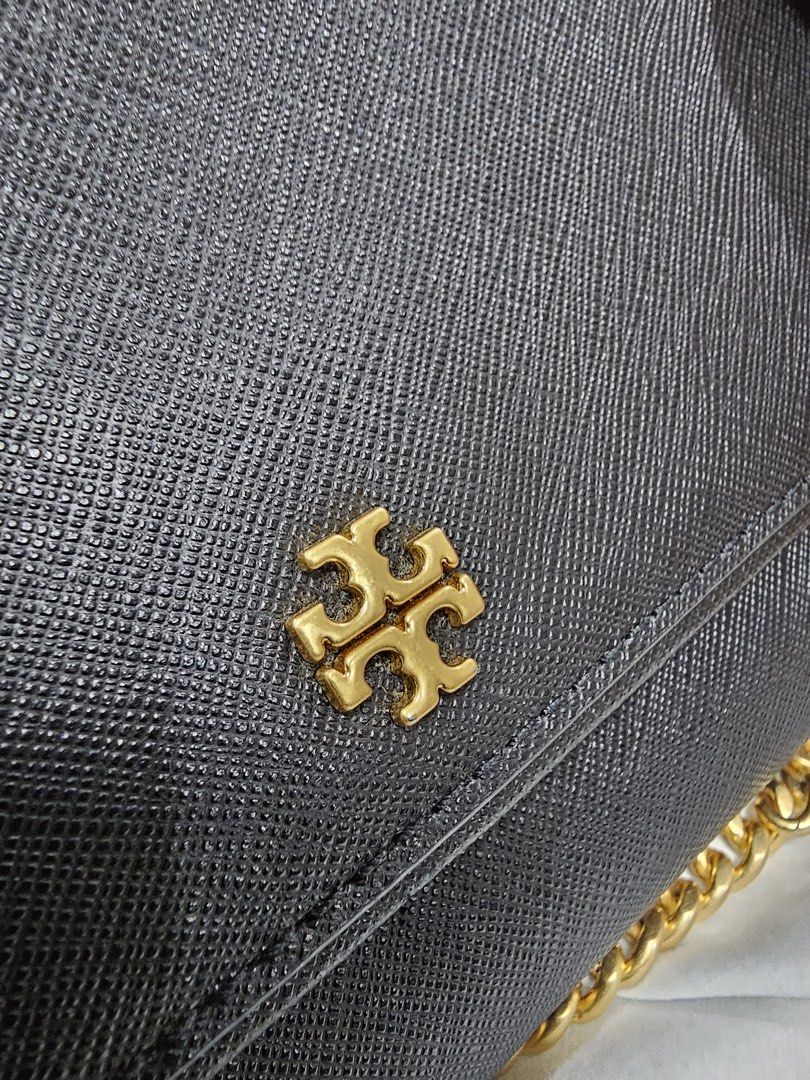 Tory Burch Emerson Chain Wallet (Category: Luxury Bags & Wallets) located in Paranaque City. Submitted by joyzann (Listing ID 1436795486, Image 2). Description: - Tory Burch Emerson Wallet on Chain - Gold chain strap - Flap closure with gold Tory Burch logo - Interior with multiple compartments - Zippered pocket - Textured material - Includes long strap for shoulder/crossbody wear - with few signs of usage. See last pictures - 17k+++ in zalora - 