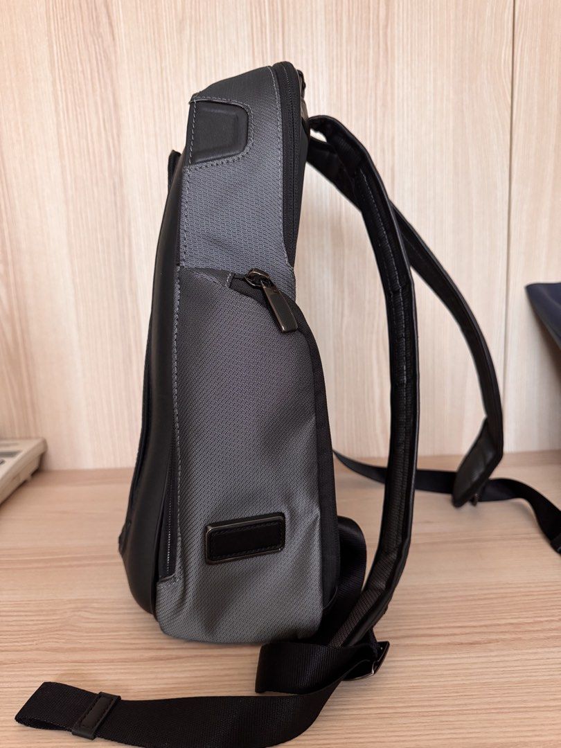 Tumi Larson Medium Backpack (Category: Backpacks) located in Quezon City. Submitted by katharus (Listing ID 1436693308, Image 3). Description: Exterior Features: - Carbon fiber detailing on right panel - Zip entry to main compartment with magnetic zip garage - Back zip entry to quilted laptop compartment (fits up to a 15” PC or 16” MacBook screen) with magentic zip garage - Padded mesh back panel for comfort and support - Add-a-Bag sleeve - Hidde