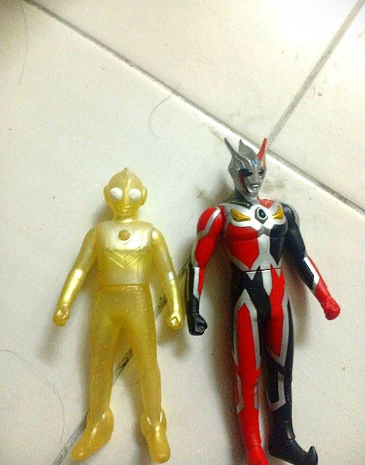 Sofubi Ultraman (Category: Figurines & Statues) located in Johor Bahru. Submitted by ultraman0505 (Listing ID 1436655087, Image 1). Description: Two Ultraman action figures are available. One figure is yellow, and the other is red, black, and silver. Both figures have detailed designs and appear to be made of plastic. They are suitable for display or play..
