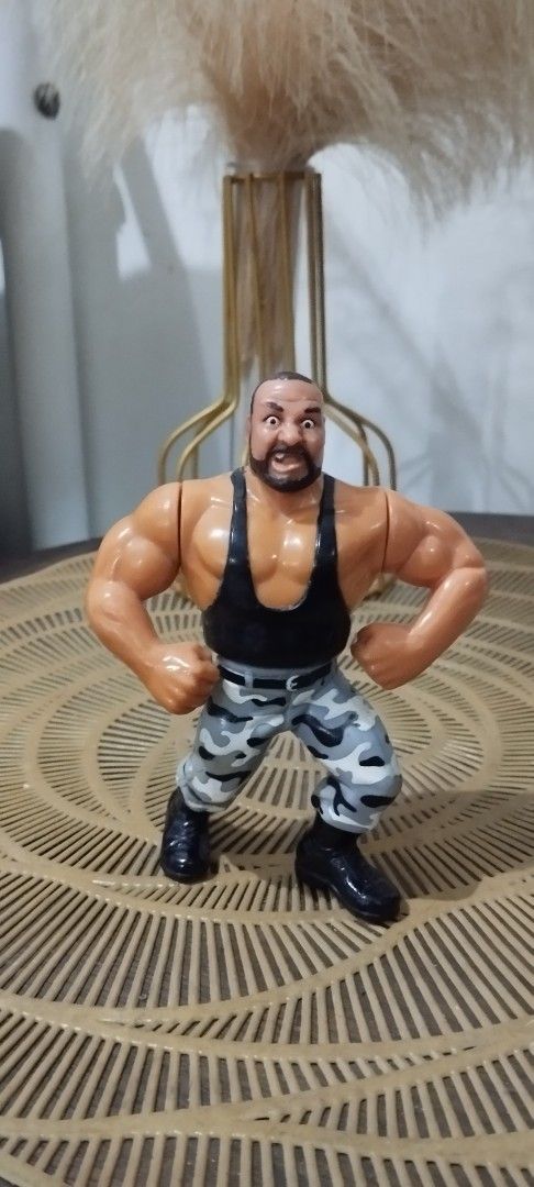 1991 Hasbro WWF Bushwacker Luke action figure (Category: Action & Battle Toys) located in Manila. Submitted by ventajetoyz625 (Listing ID 1436678889, Image 1). Description: - Vintage wrestling action figure - Muscular wrestler design - Black tank top and camouflage pants - Detailed with a beard - Flexing arm pose - Made of plastic - "Gimmick" not working - What you see is what you get.