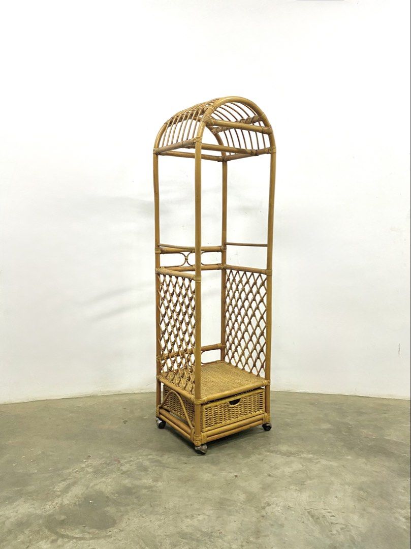 Vintage Rattan Clothes Rack with Drawer (Category: Shelves, Cabinets & Racks) located in Santa Rosa. Submitted by annie_annie83 (Listing ID 1436731880, Image 1). Description: - Vintage rattan clothes rack - Unique arched top design - Built-in drawer for storage - Woven lattice sides - Additional shelf - Mounted on wheels for easy movement - Ideal for bedroom or dressing area.