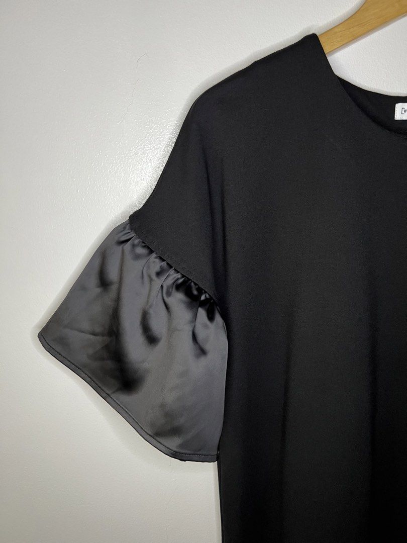 Warehouse Black Top with Ruffle Sleeves (Category: Blouses) located in Quezon City. Submitted by pcera (Listing ID 1436786666, Image 3). Description: - Warehouse black top - Size 10 - Elegant ruffle sleeves - Round neckline - Classic, simple design - Smooth, solid black fabric - Satin-like sleeves.