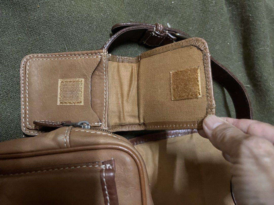 Western Leather Belt Bag (Category: Cross-body Bags) located in Los Banos. Submitted by profemy (Listing ID 1436690926, Image 2). Description: - Brown leather belt bag - Main compartment with flap closure - Attached wallet with velcro closure - Adjustable brown strap - Western logo - Lined with lighter-colored fabric.