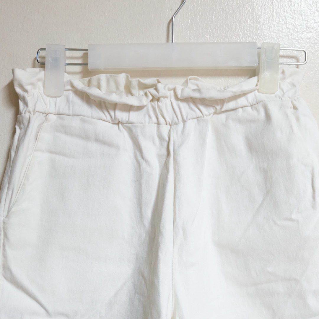 White Paperbag High-Waisted Shorts (Category: Shorts) located in Manila. Submitted by thecooldeclutterer (Listing ID 1436777219, Image 2). Description: • Fit: High-waisted paperbag style with elastic waistband. • Features: Functional side pockets and breathable fabric. • Quality: Clean white color, no stains or visible wear. KEYWORDS: White Shorts, Paperbag Shorts, High Waisted, Summer Shorts, Casual Shorts, Elastic Shorts, White Bottoms, Beach S