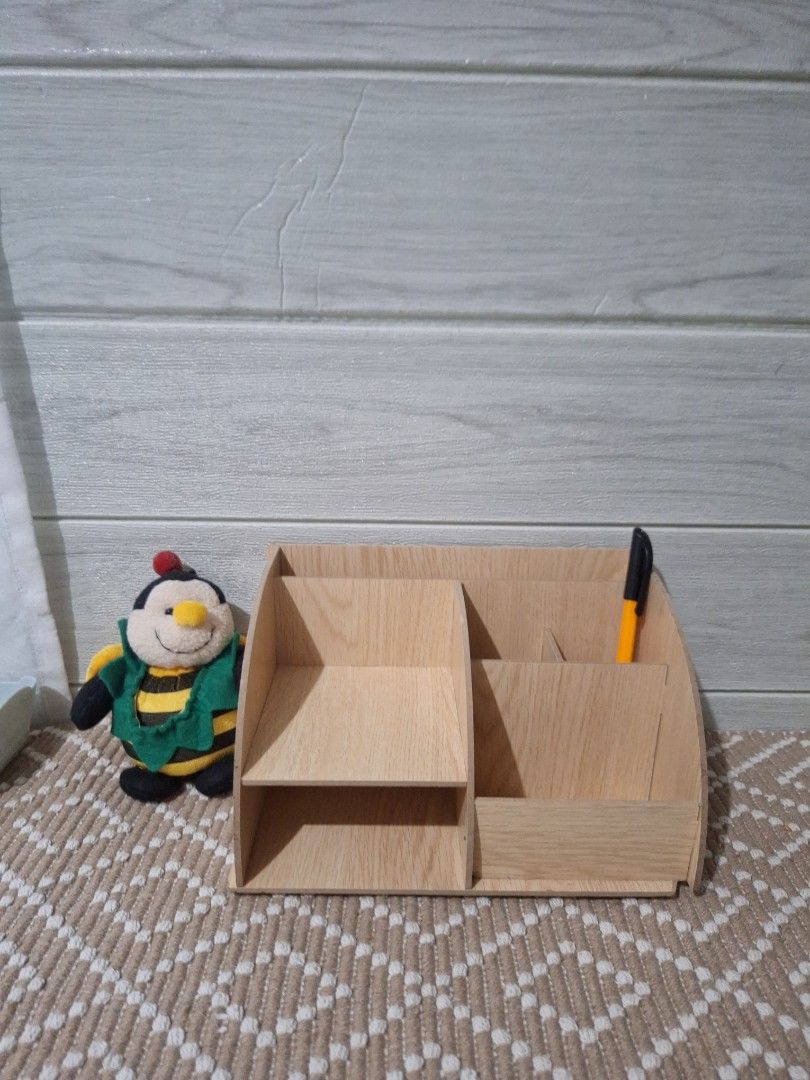 Wooden Desk Organizer (Category: Tables & Sets) located in Legazpi City. Submitted by bellebargainbox (Listing ID 1436665723, Image 1). Description: - Wooden desk organizer - Multiple compartments for pens, pencils, and small items - Natural wood finish - Unique design - Assembled with interlocking pieces - Practical and stylish - with very slight flaw see pics.