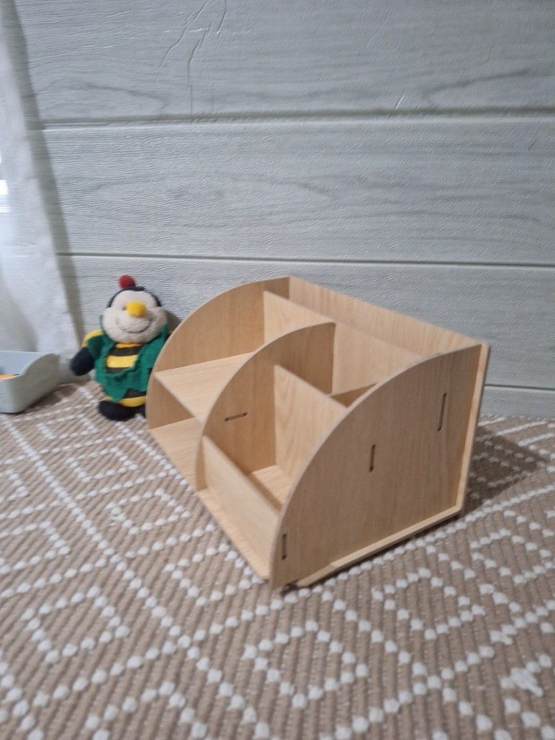 Wooden Desk Organizer (Category: Tables & Sets) located in Legazpi City. Submitted by bellebargainbox (Listing ID 1436665723, Image 3). Description: - Wooden desk organizer - Multiple compartments for pens, pencils, and small items - Natural wood finish - Unique design - Assembled with interlocking pieces - Practical and stylish - with very slight flaw see pics.