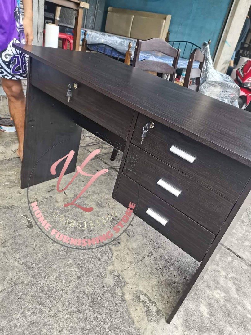 Wooden Office Desk with Drawers (Category: Office Furniture & Fixtures) located in Manila. Submitted by lykcacamacho (Listing ID 1436768920, Image 3). Description: - Durable wooden office desk - Multiple drawers for storage - Lockable top drawer for security - Dark wood grain finish - Sturdy construction - Suitable for home and office use - Simple, functional design.