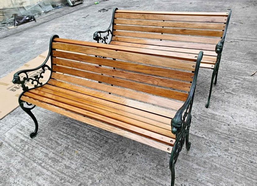 Wooden Park Bench with Cast Iron Frame (Category: Chairs) located in Manila. Submitted by lykcacamacho (Listing ID 1436659690, Image 2). Description: - Elegant wooden park bench - Cast iron frame with decorative detailing - Natural wood finish - Horizontal slats for seat and backrest - Ideal for gardens, patios, and public spaces - Multiple benches available.