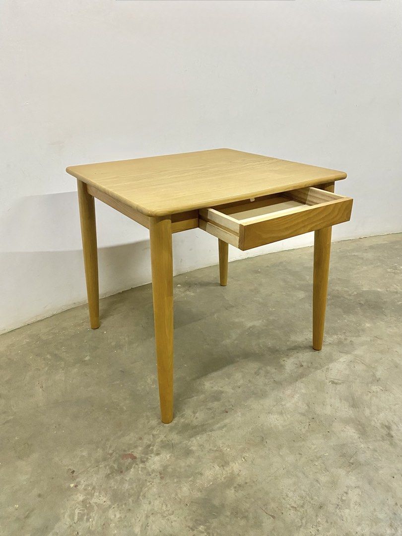 Wooden Square Table with Drawer (Category: Tables & Sets) located in Santa Rosa. Submitted by annie_annie83 (Listing ID 1436731212, Image 2). Description: - Square wooden table - Natural wood finish - Modern design - Features a drawer - Rounded edges - Suitable as side table or small dining table - Functional and stylish.