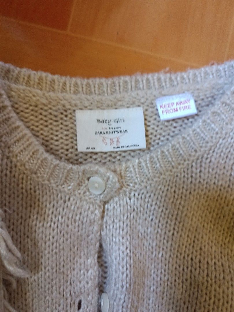 Zara Knitwear Baby Girl Cardigan (Category: Babies & Kids Fashion) located in Muntinlupa City. Submitted by ciciloves (Listing ID 1436690600, Image 2). Description: - Zara baby girl cardigan - Size: 2-3 years - Features: Button-down front, round neckline, fringe sleeves - Material: Knit - Color: Neutral.